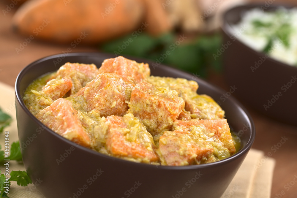 Bowl of vegetarian sweet potato and coconut curry Bowl of vegetarian sweet potato and coconut curry