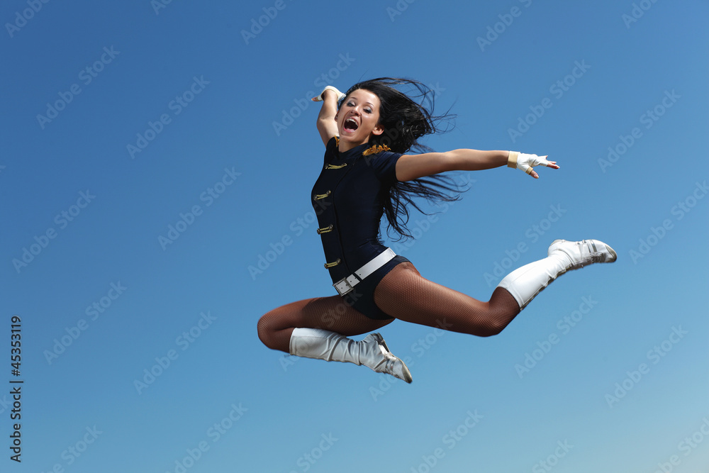 Young female dancer against white background Young female dancer against white background