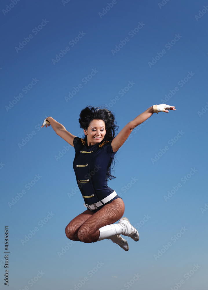 Young female dancer against white background Young female dancer against white background