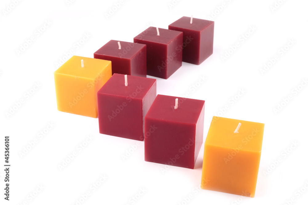 Yellow and red candles on a white background Yellow and red candles on a white background