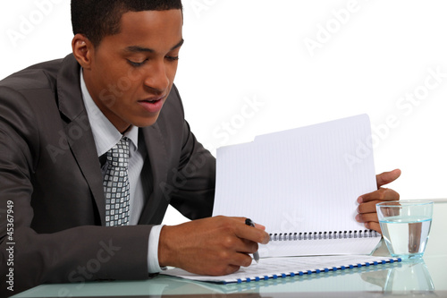 Businessman reviewing a report photo
