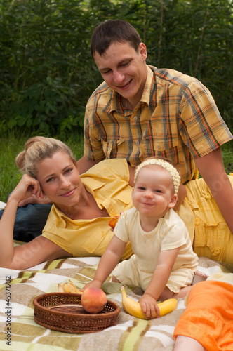 Happy family picnicking outdoors