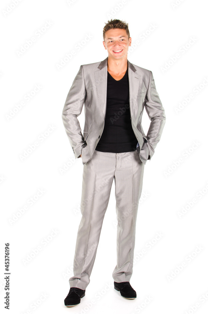 Portrait of young man in suit standing against white background Portrait of young man in suit standing against white background