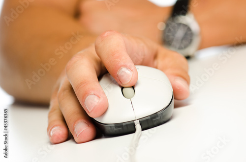 Student's hand using computer mouse