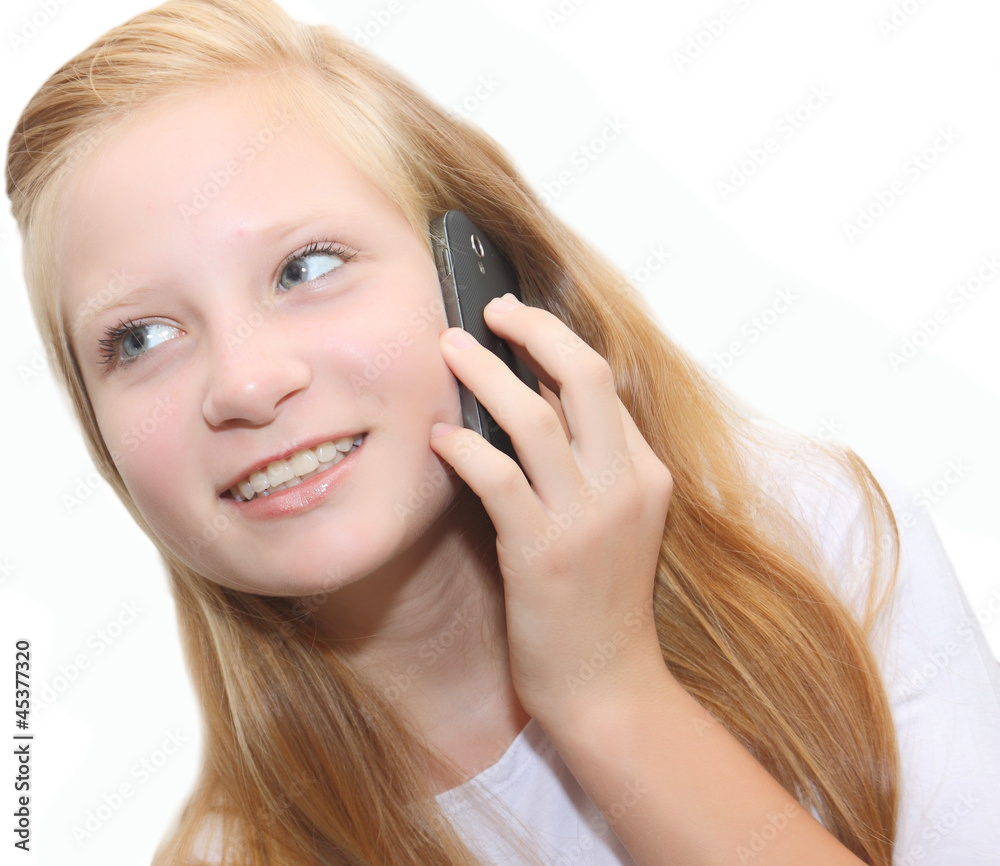 Happy teenager holding cell phone. Isolated on white background Happy teenager holding cell phone. Isolated on white background