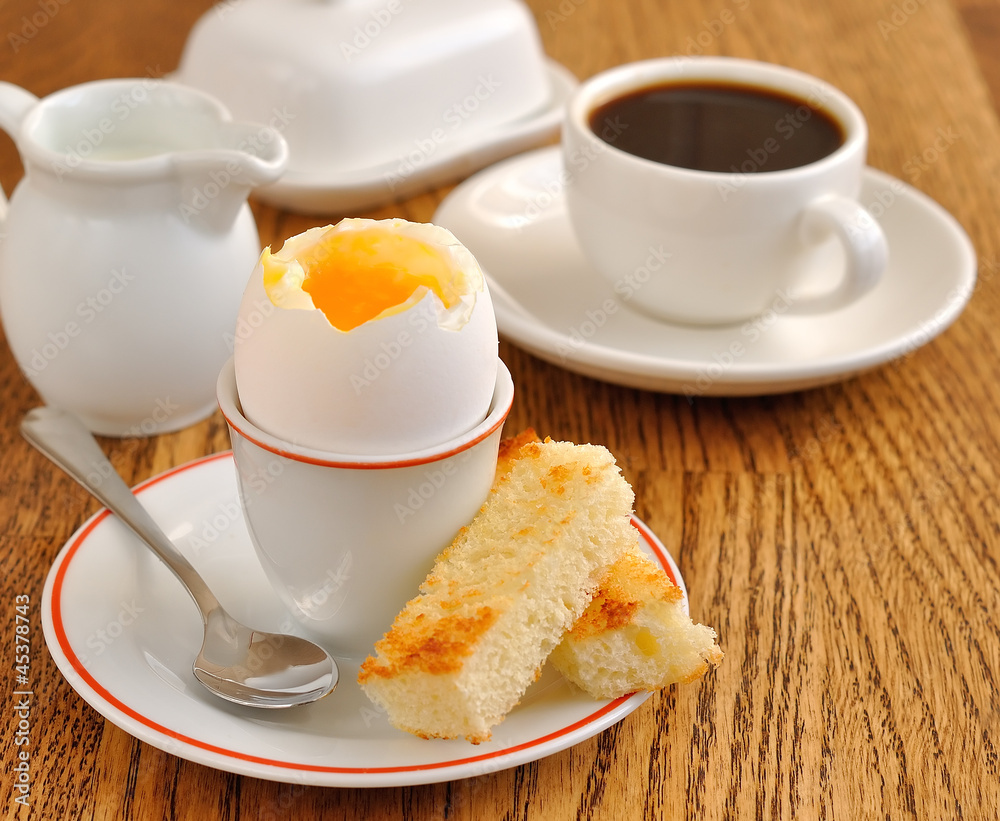 Fototapeta premium soft-boiled egg on a brown table