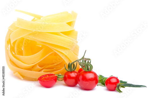 spaghetti and ripe tomatoes, isolated over white background
