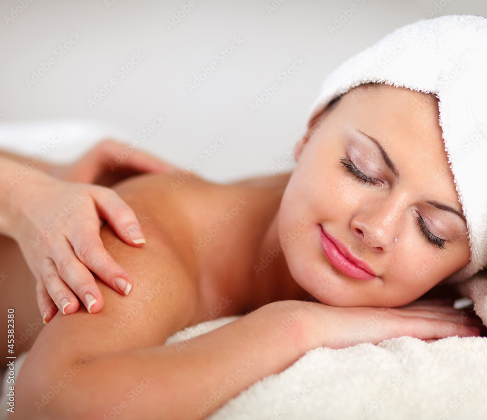 Closeup of an attractive young woman receiving massage Closeup of an attractive young woman receiving massage