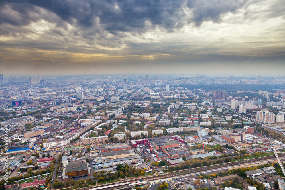 panorama with dark yellow clouds under autumn Moscow