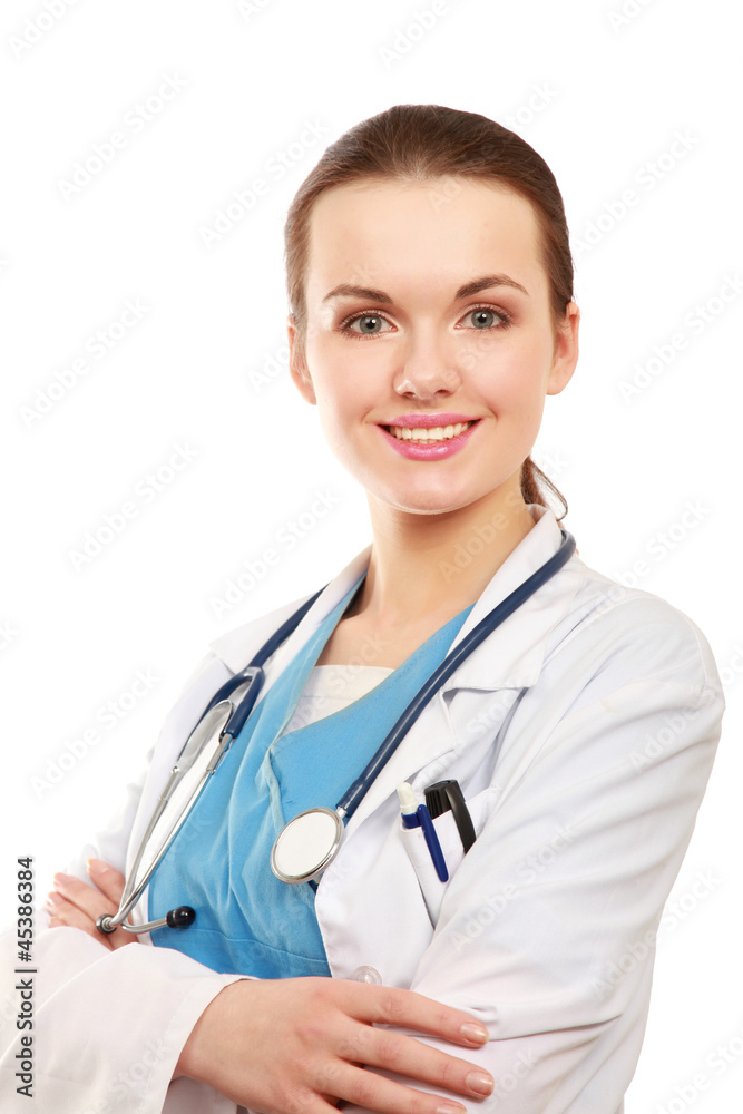 Fototapeta premium Happy young nurse standing with folded arms