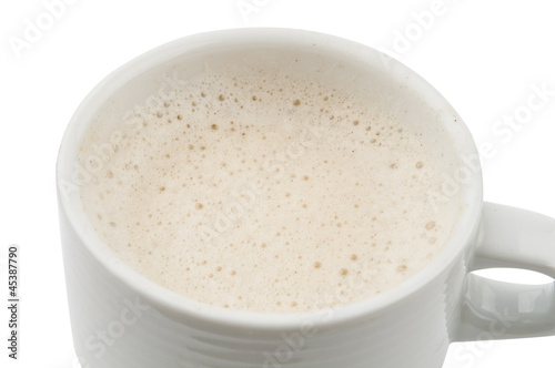 frothy cappuccino in a cup