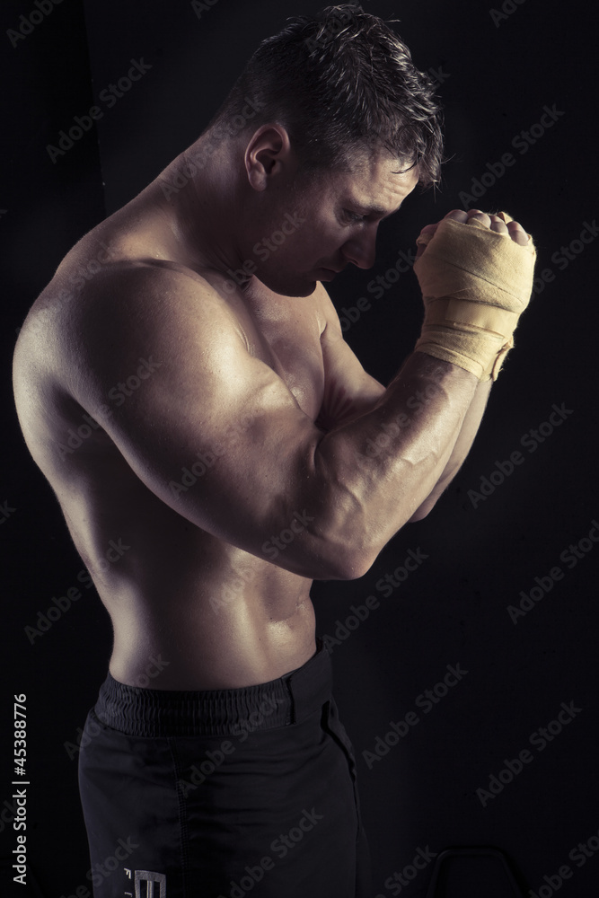 Moody dark portrait of sexy bodybuilder Moody dark portrait of sexy bodybuilder