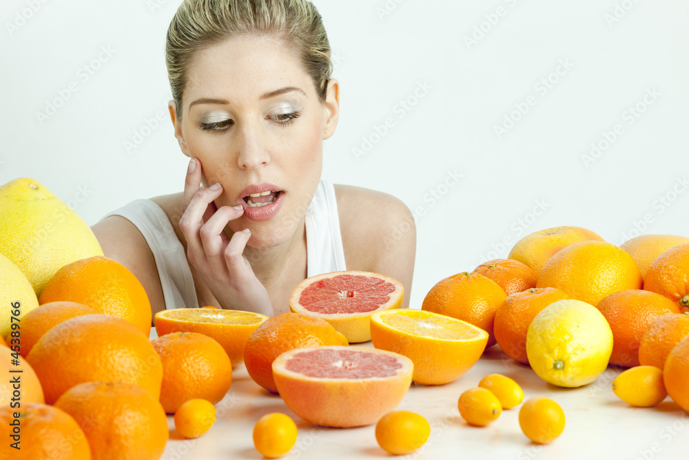 portrait of young woman with citrus fruit portrait of young woman with citrus fruit
