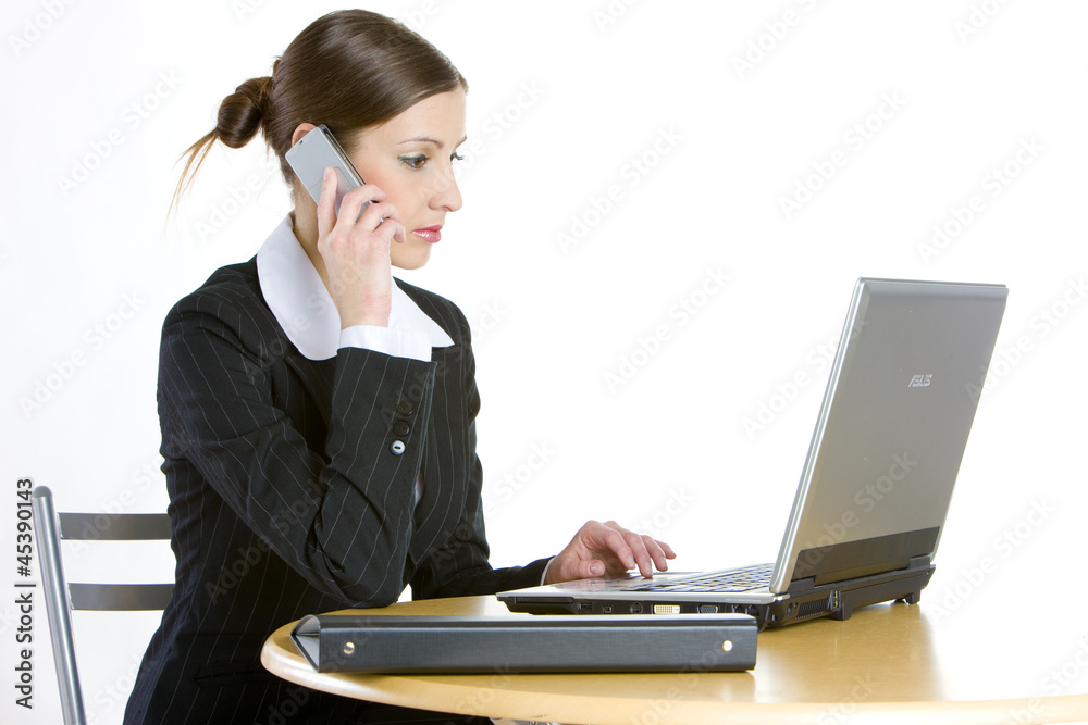 telephoning businesswoman with a laptop telephoning businesswoman with a laptop