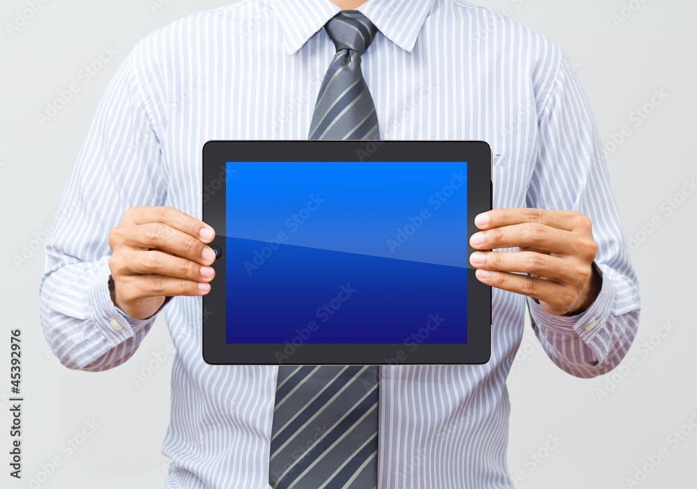 Businessman working on a digital tablet Businessman working on a digital tablet
