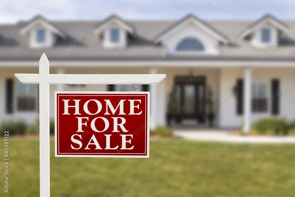 For Sale Real Estate Sign In Front Of New House Stock Photo