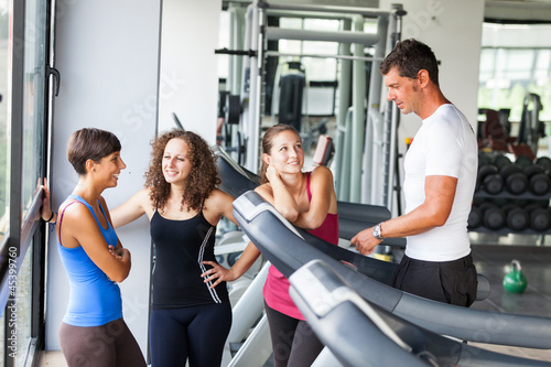 Attractive Man at Gym with Three Women