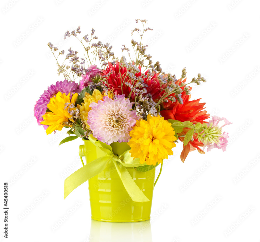 Fototapeta premium Bright green bucket with flowers isolated on white