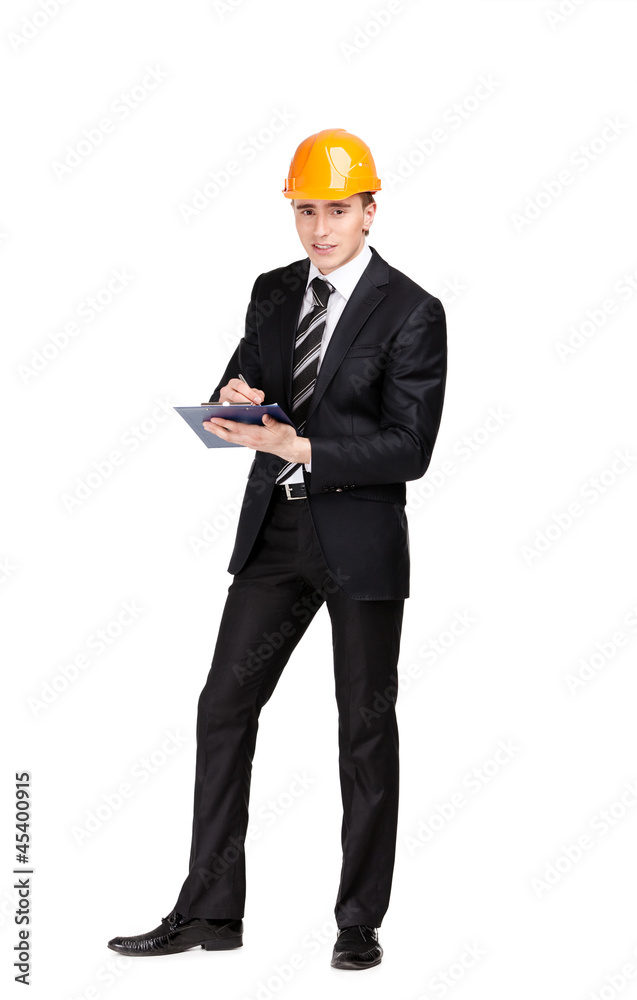 Making notes man in orange hard hat and suit, isolated on white Making notes man in orange hard hat and suit, isolated on white