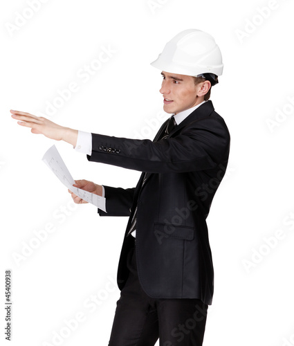 Businessman in white helmet pointing at something