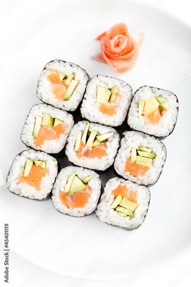Sushi rolls with sashimi, isolated on white. Top view