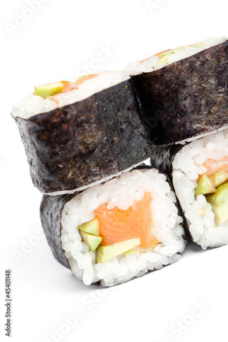 Maki sushi rolls stand on each other, isolated on white