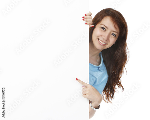 Woman Pointing At Blank Wall