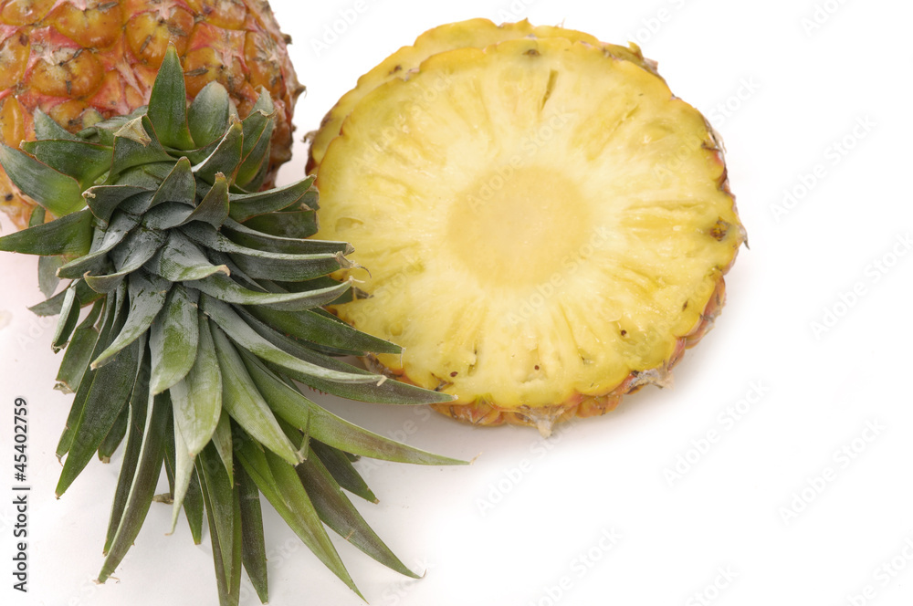 fresh pineapple fruits with cut and green leaves fresh pineapple fruits with cut and green leaves