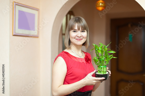 woman with lucky bamboo photo