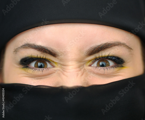 Canvas Print Angry girl in a black yashmak
