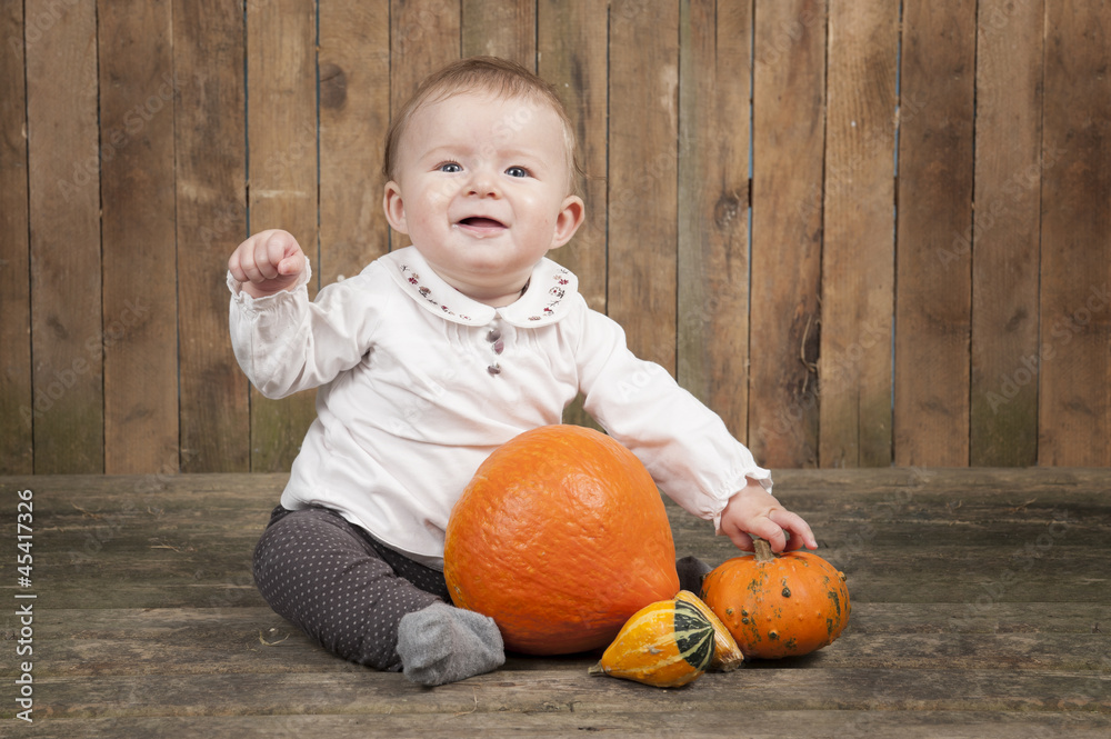 Fototapeta premium halloween baby with pumpkins