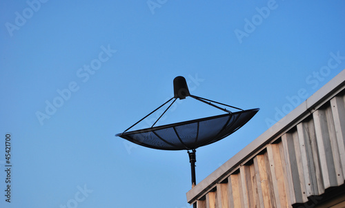 Satellite dish in blue sky