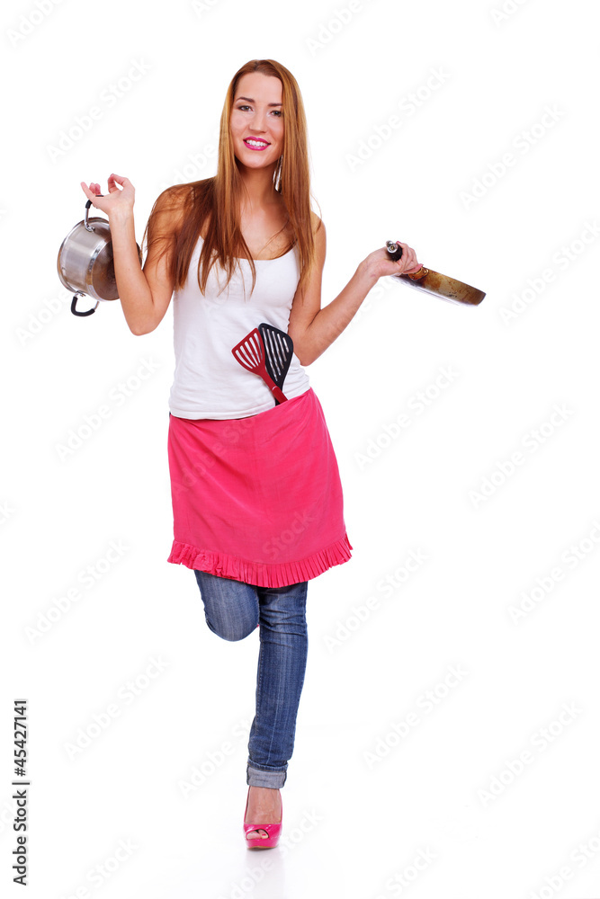 Portrait of beautiful girl posing on white background in kitchen Portrait of beautiful girl posing on white background in kitchen