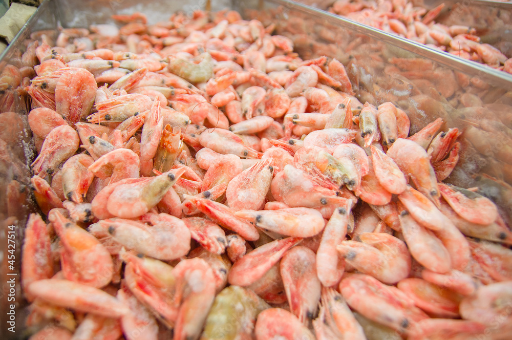 Bunch of fresh shrimps in fridge in supermarket
