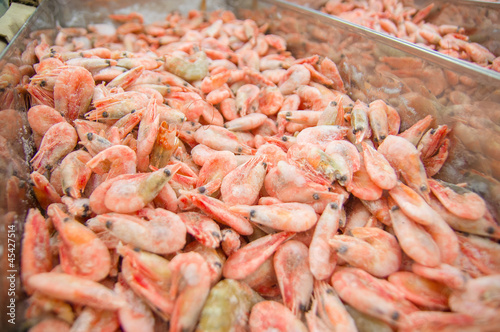 Bunch of fresh shrimps in fridge in supermarket