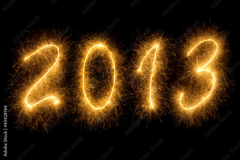 2013 written in sparkling letters on black background 2013 written in sparkling letters on black background