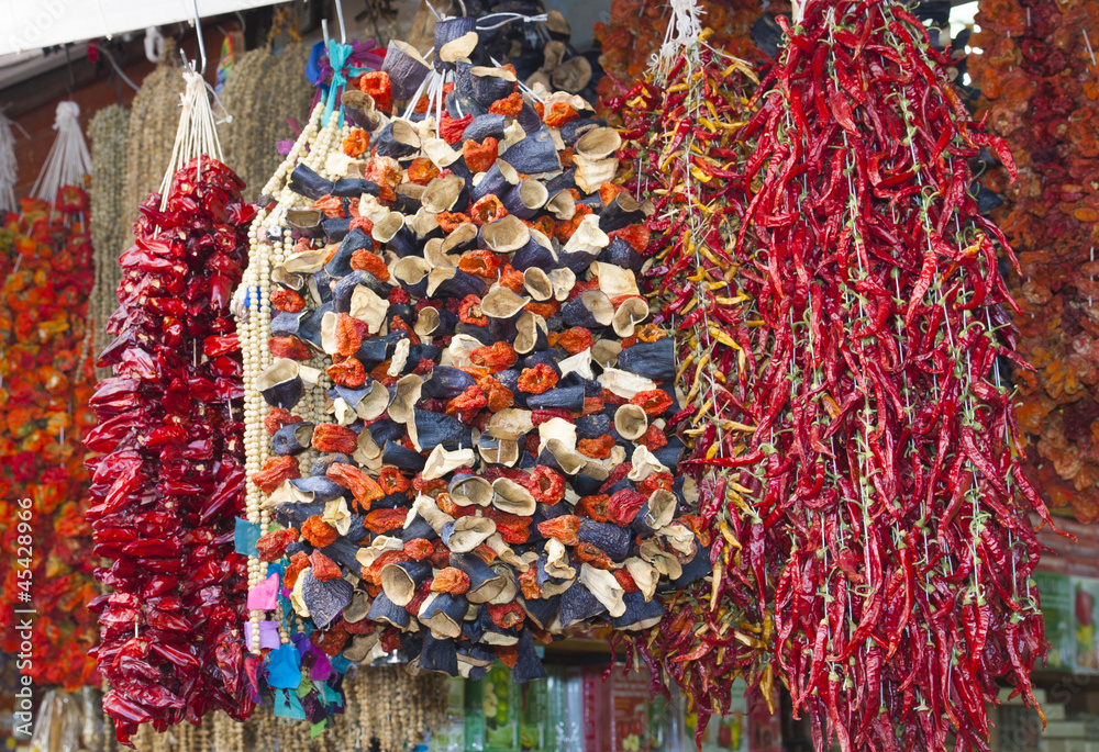 Dried vegetables hanging at a market