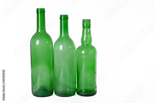 three diffetent empty bottles