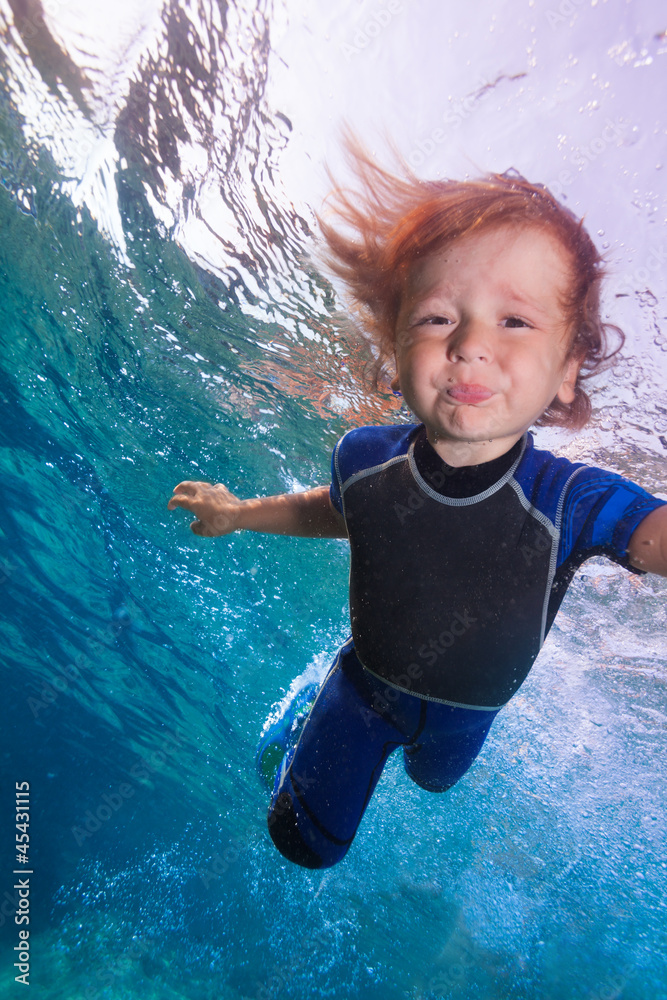 funny little boy underwater