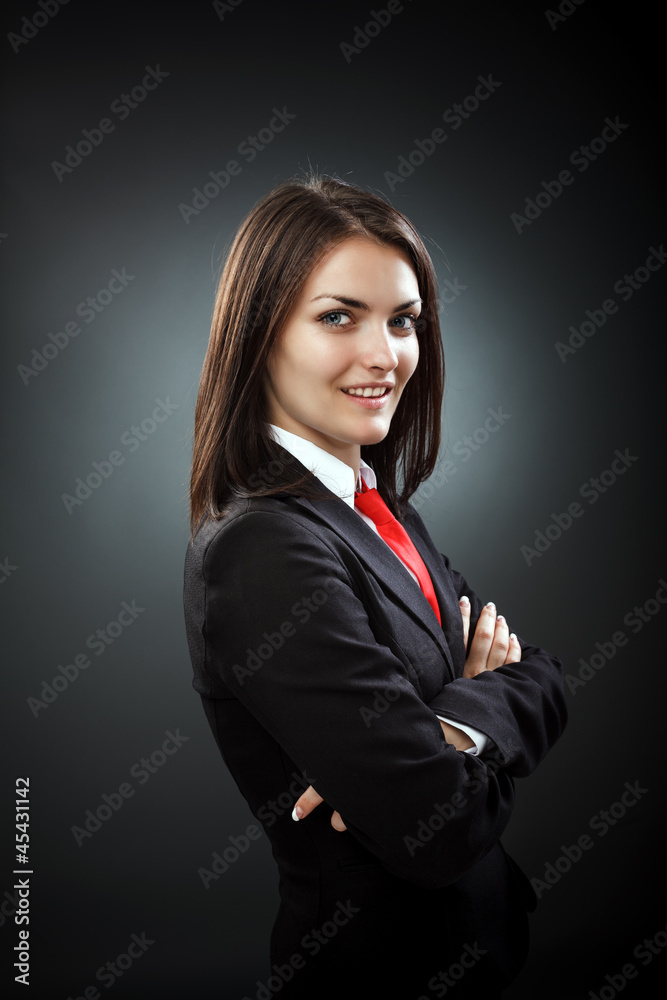 Happy young businesswoman wearing suit and necktie, isolated on Happy young businesswoman wearing suit and necktie, isolated on
