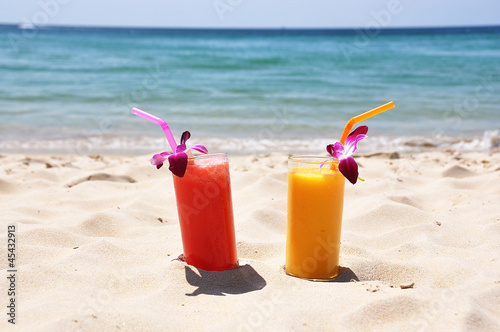 Pair of fruit shakes on the tropical beach