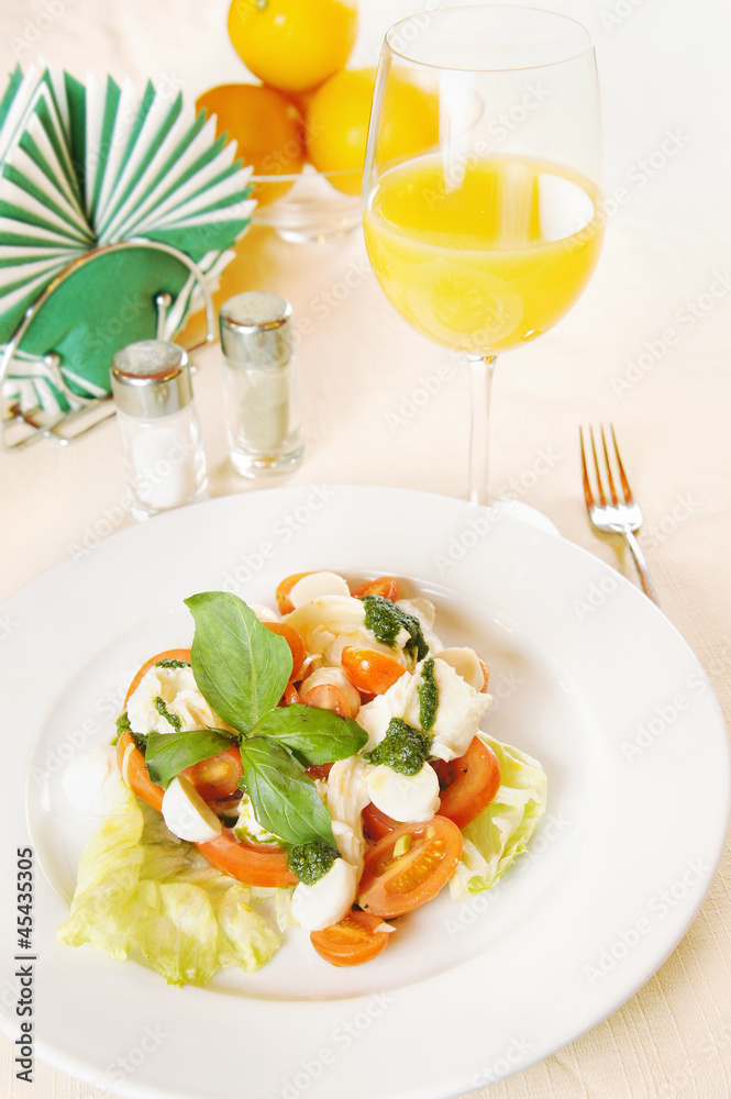 Classical Italian salad with vegetables on the plate Classical Italian salad with vegetables on the plate