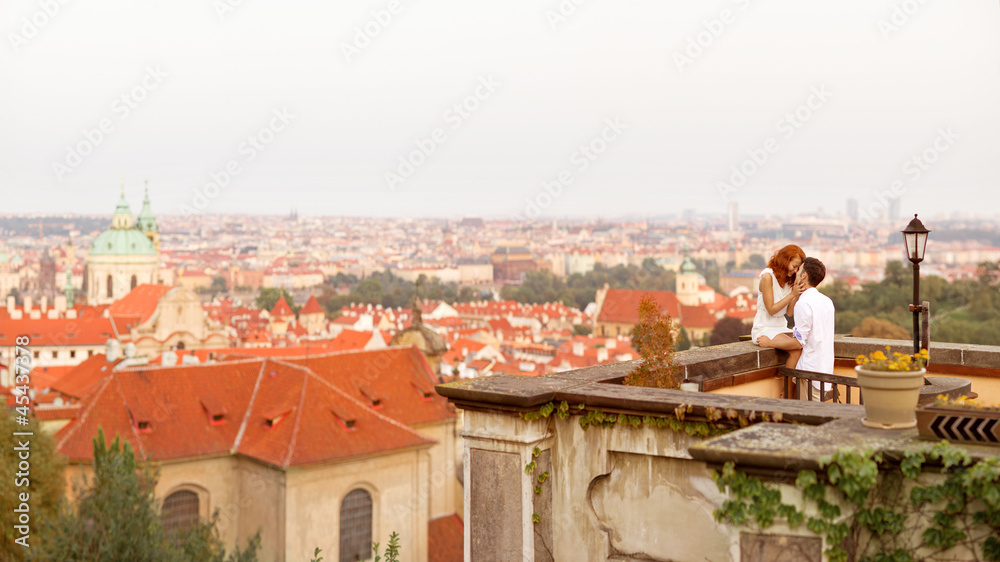 Young couple walking in old town of Prague