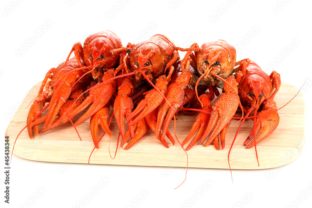 Tasty boiled crayfishes on chopping board isolated on white Tasty boiled crayfishes on chopping board isolated on white