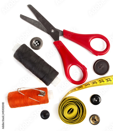 tools for needlework thread scissors and tape measure photo