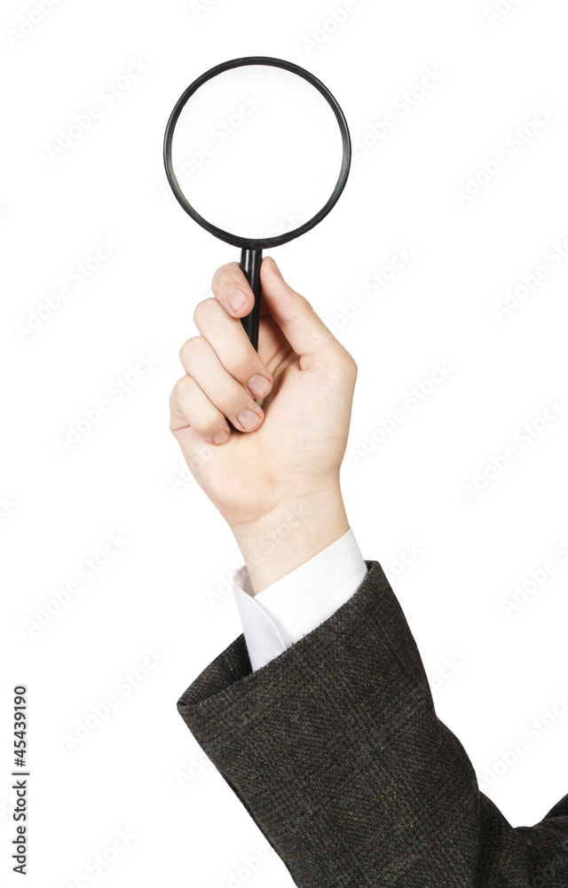 Magnifying glass in hand isolated on white background Magnifying glass in hand isolated on white background