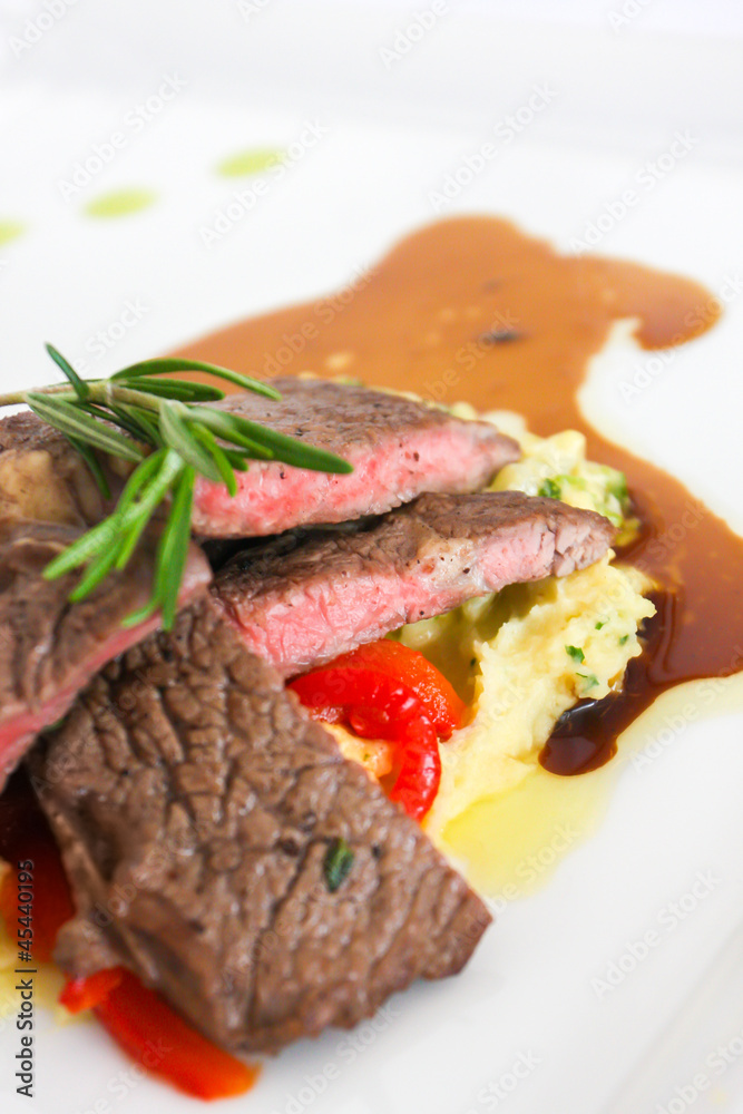 Sirloin beef steak with mashed potato and tomato