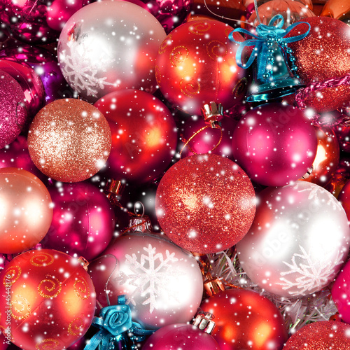 Beautiful Christams balls on a falling snow background photo