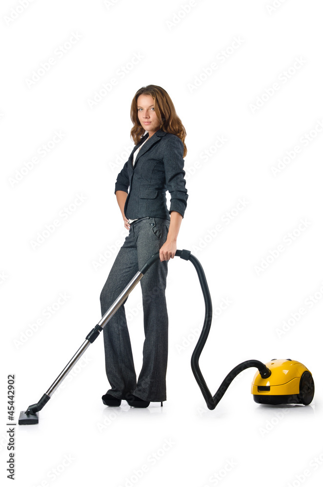 Businesswoman cleaning with vacuum cleaner