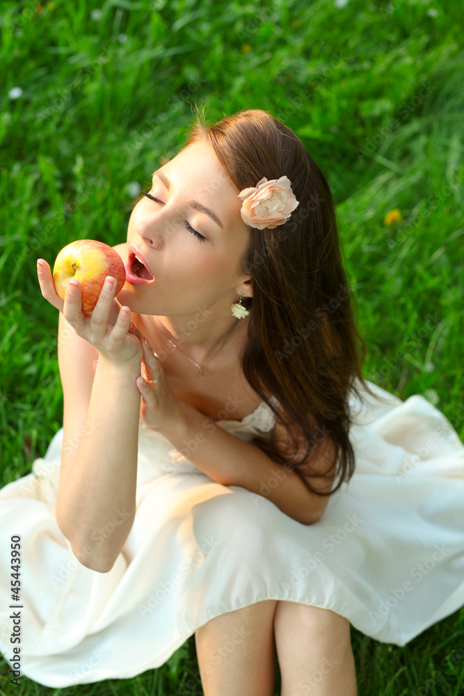 Adorable happy young lady with beautiful sappy apple Adorable happy young lady with beautiful sappy apple